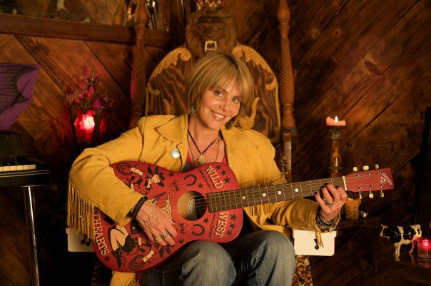 Sarah Taylor playing guitar.